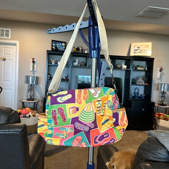 Lily Bloom cross-body purse with flip-flops and sun hats.Size 10 by 8 inches - Picture 2 of 8